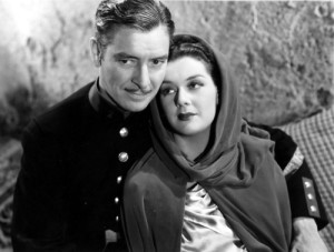 Ronald Colman e Rosalind Russell em Sob Duas bandeiras