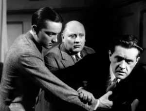 Roland Toutain (à esq.) como Rouletabille